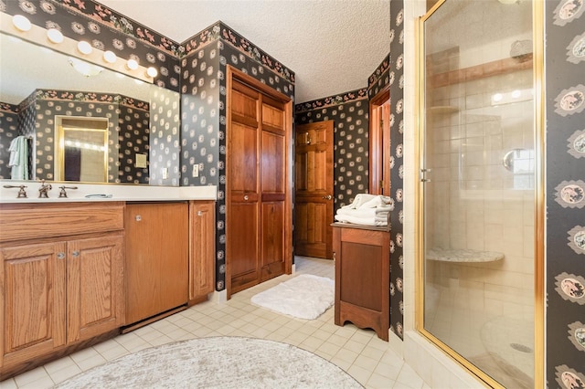 132 Pleasant Valley Dr, Daytona Beach, FL 32114 - full bath featuring wallpapered walls, vanity, a stall shower, and a textured ceiling