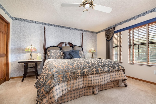 132 Pleasant Valley Dr, Daytona Beach, FL 32114 - bedroom with a ceiling fan, baseboards, carpet floors, wallpapered walls, and a textured ceiling