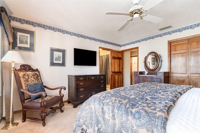 132 Pleasant Valley Dr, Daytona Beach, FL 32114 - bedroom featuring a ceiling fan, baseboards, visible vents, a textured ceiling, and light colored carpet