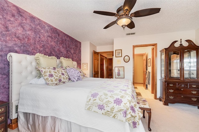 132 Pleasant Valley Dr, Daytona Beach, FL 32114 - bedroom with carpet flooring, a ceiling fan, visible vents, and a textured ceiling