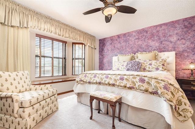 132 Pleasant Valley Dr, Daytona Beach, FL 32114 - carpeted bedroom featuring wallpapered walls, an accent wall, baseboards, and ceiling fan