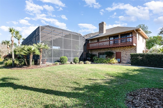 132 Pleasant Valley Dr, Daytona Beach, FL 32114 - rear view of house featuring brick siding, a lawn, a chimney, and glass enclosure
