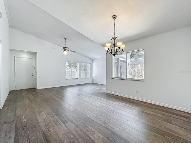 2253 Atrium Cir, Orlando, FL 32808 - unfurnished dining area with a chandelier, vaulted ceiling, dark wood-style flooring, baseboards, and a ceiling fan