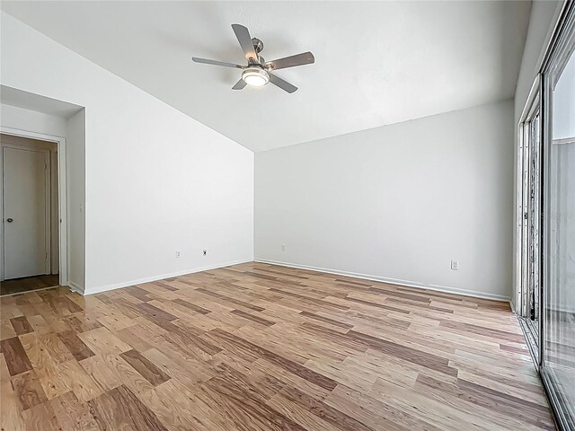 2253 Atrium Cir, Orlando, FL 32808 - unfurnished bedroom with lofted ceiling, light wood finished floors, baseboards, and ceiling fan
