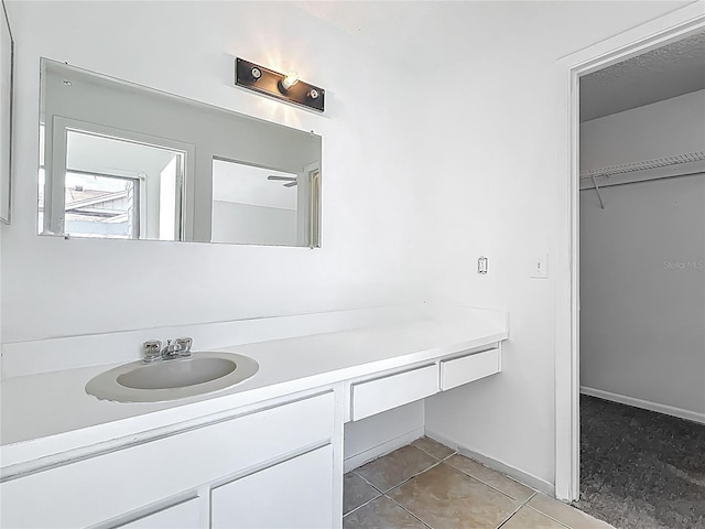 2253 Atrium Cir, Orlando, FL 32808 - bathroom featuring vanity, baseboards, and tile patterned flooring