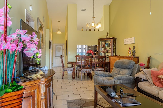 1260 Parkside Green Dr Unit D, Greenacres, FL 33415 - living area with tile patterned floors, visible vents, a notable chandelier, and a towering ceiling