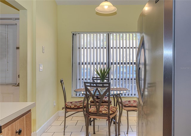 1260 Parkside Green Dr Unit D, Greenacres, FL 33415 - dining space featuring light tile patterned flooring and baseboards