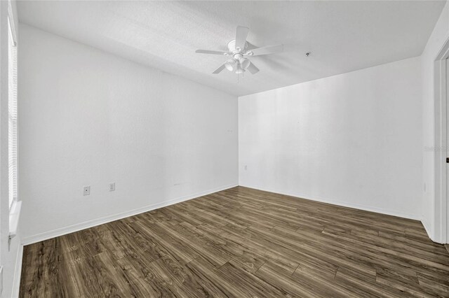 2314 Midtown Ter Unit 1136, Orlando, FL 32839 - empty room featuring baseboards, a ceiling fan, and dark wood-style flooring