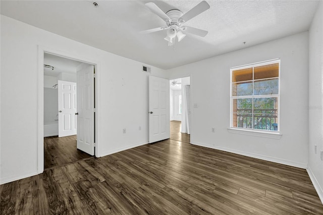 2314 Midtown Ter Unit 1136, Orlando, FL 32839 - unfurnished bedroom with baseboards, visible vents, and dark wood-style flooring