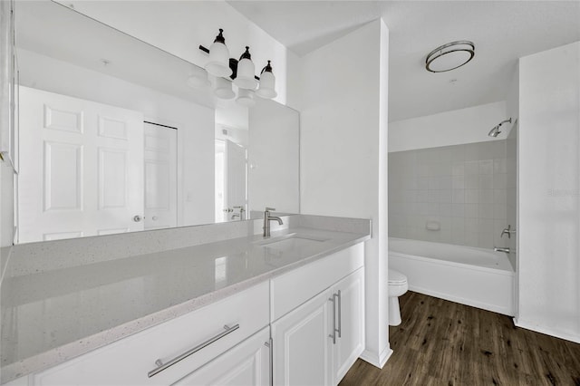 2314 Midtown Ter Unit 1136, Orlando, FL 32839 - full bath with tub / shower combination, toilet, an inviting chandelier, wood finished floors, and vanity
