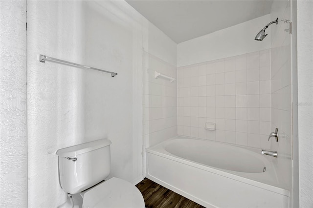2314 Midtown Ter Unit 1136, Orlando, FL 32839 - bathroom with toilet, wood finished floors, and shower / tub combination