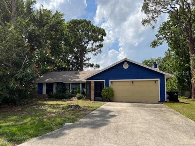 271 Naylor St NE, Palm Bay, FL 32907 - ranch-style house with a garage, driveway, and a front lawn