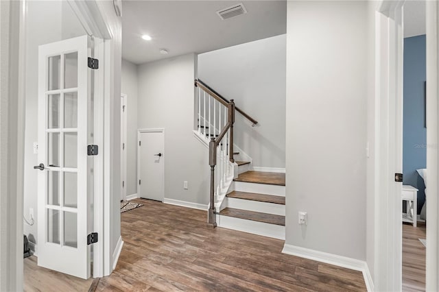 4622 Eureka Ln, Sanford, FL 32773 - entryway featuring visible vents, stairway, baseboards, and wood finished floors