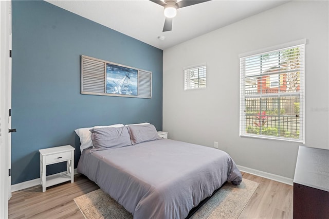 4622 Eureka Ln, Sanford, FL 32773 - bedroom featuring baseboards, light wood-style floors, and a ceiling fan