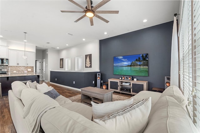 4622 Eureka Ln, Sanford, FL 32773 - living area with recessed lighting, dark wood-type flooring, ceiling fan, and an accent wall
