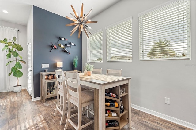 4622 Eureka Ln, Sanford, FL 32773 - dining space with baseboards, an inviting chandelier, and wood finished floors