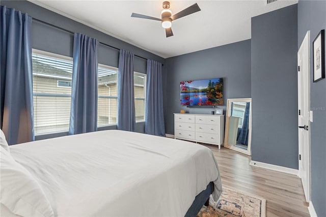 4622 Eureka Ln, Sanford, FL 32773 - bedroom featuring ceiling fan, light wood-type flooring, and baseboards