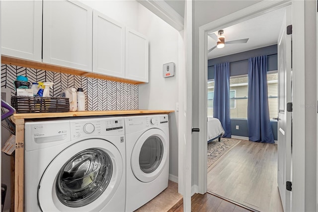 4622 Eureka Ln, Sanford, FL 32773 - washroom featuring cabinet space, light wood-style floors, independent washer and dryer, and ceiling fan