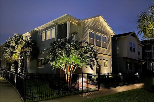 4622 Eureka Ln, Sanford, FL 32773 - view of home's exterior featuring a fenced front yard and stucco siding