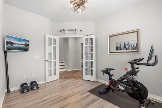 4622 Eureka Ln, Sanford, FL 32773 - workout room featuring french doors, baseboards, and wood finished floors