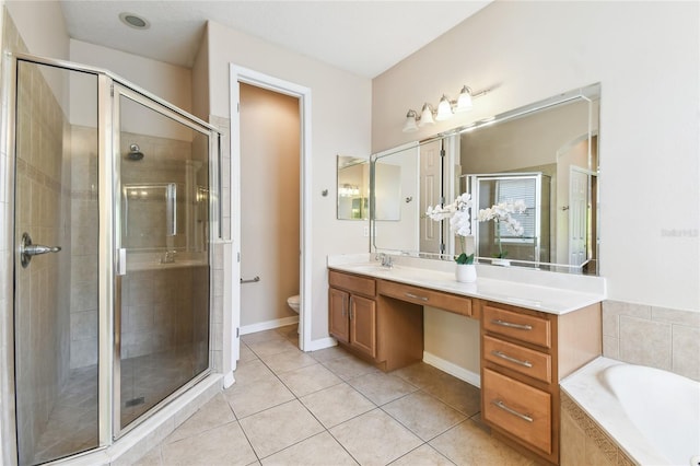 full bathroom with tile patterned flooring, vanity, toilet, a stall shower, and a bath