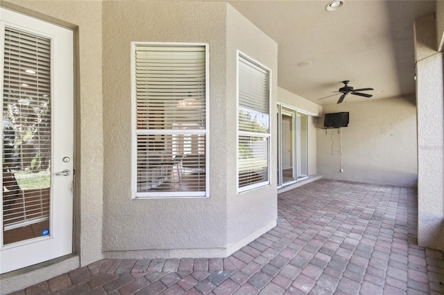 view of patio featuring a ceiling fan