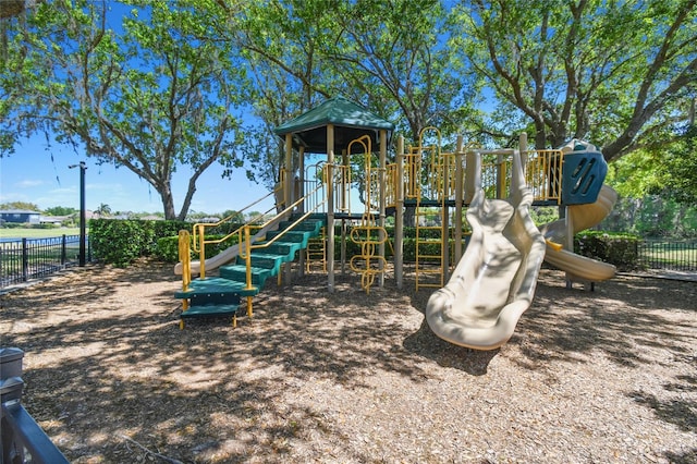 communal playground featuring fence