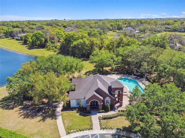 bird's eye view featuring a water view and a forest view