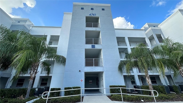 view of building exterior with central AC unit