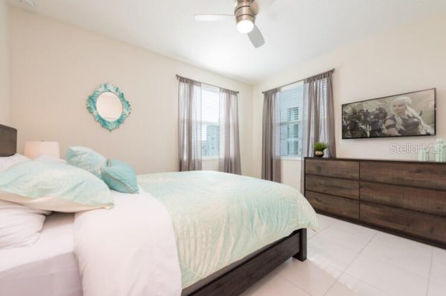 bedroom with tile patterned floors and ceiling fan