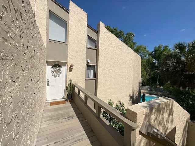 204 Tomoka Trl Unit 204, Longwood, FL 32779 - doorway to property with stucco siding