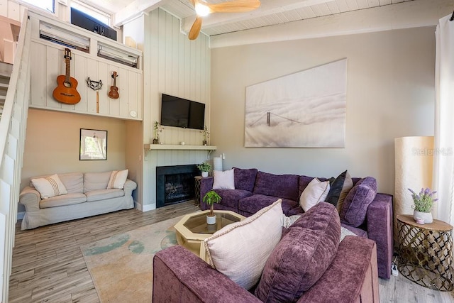 204 Tomoka Trl Unit 204, Longwood, FL 32779 - living room with a fireplace, ceiling fan, vaulted ceiling with beams, and wood finished floors