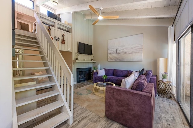 204 Tomoka Trl Unit 204, Longwood, FL 32779 - living area featuring ceiling fan, lofted ceiling with beams, a fireplace, stairway, and wood finished floors