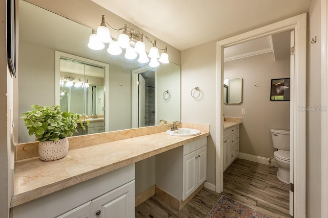 204 Tomoka Trl Unit 204, Longwood, FL 32779 - bathroom featuring toilet, wood finished floors, vanity, and baseboards