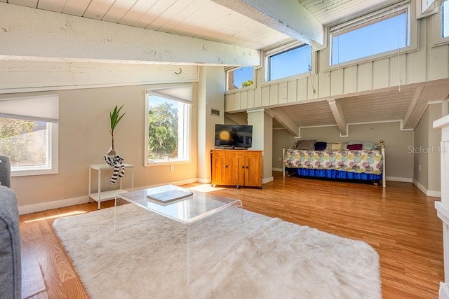 204 Tomoka Trl Unit 204, Longwood, FL 32779 - bedroom with multiple windows, baseboards, and vaulted ceiling with beams
