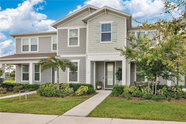 11038 Leafshore Loop, Orlando, FL 32829 - multi unit property featuring a front lawn