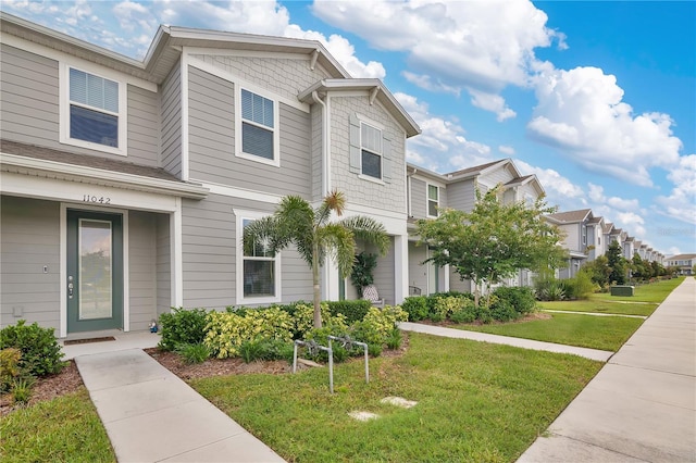 11038 Leafshore Loop, Orlando, FL 32829 - view of front of house with a front yard and a residential view