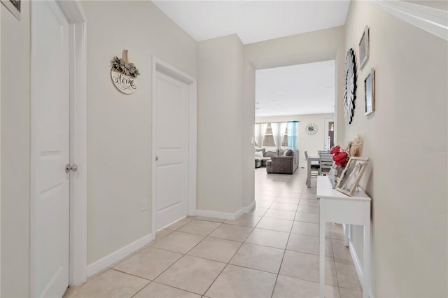 11038 Leafshore Loop, Orlando, FL 32829 - corridor with light tile patterned floors and baseboards
