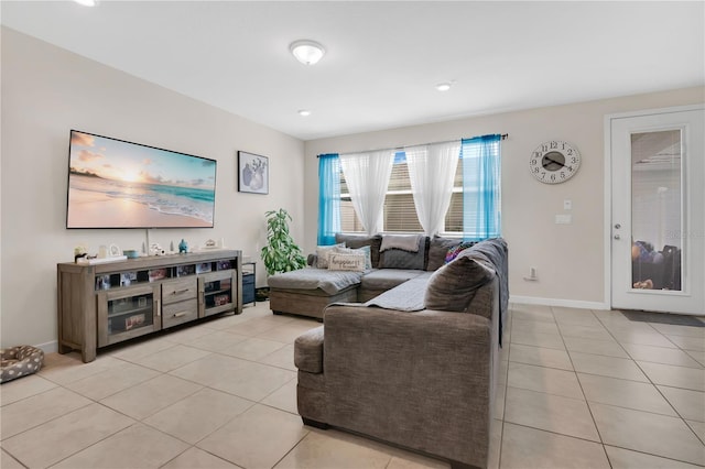 11038 Leafshore Loop, Orlando, FL 32829 - living room featuring light tile patterned floors and recessed lighting