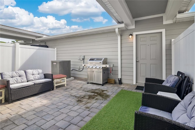 11038 Leafshore Loop, Orlando, FL 32829 - view of patio / terrace with a grill and an outdoor living space