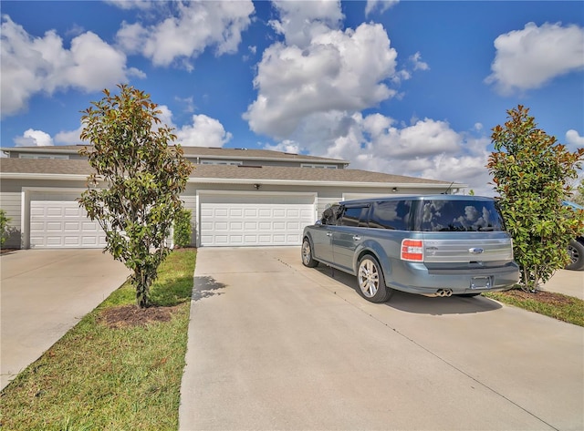 11038 Leafshore Loop, Orlando, FL 32829 - view of front facade with driveway, a garage, and roof with shingles