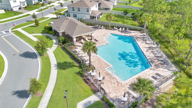 11038 Leafshore Loop, Orlando, FL 32829 - community pool featuring a residential view and a patio