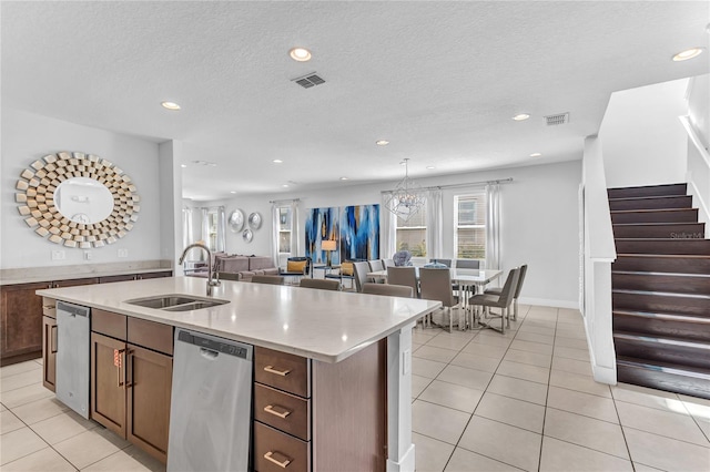 501 Burma St, Kissimmee, FL 34747 - kitchen with a sink, visible vents, dishwasher, and an island with sink
