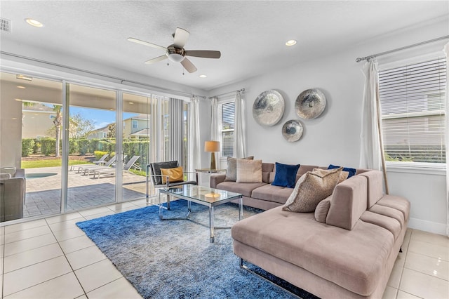 501 Burma St, Kissimmee, FL 34747 - living room with tile patterned floors, recessed lighting, a ceiling fan, and a wealth of natural light
