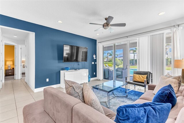 501 Burma St, Kissimmee, FL 34747 - living area featuring light tile patterned floors, baseboards, ceiling fan, and recessed lighting