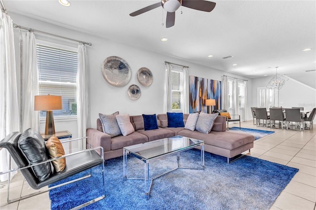 501 Burma St, Kissimmee, FL 34747 - tiled living area featuring recessed lighting, visible vents, and ceiling fan with notable chandelier