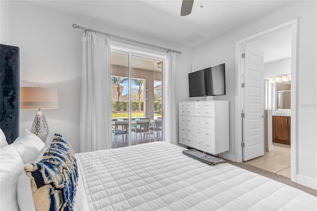 501 Burma St, Kissimmee, FL 34747 - carpeted bedroom with ensuite bath, access to exterior, and ceiling fan
