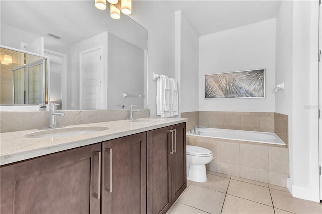 501 Burma St, Kissimmee, FL 34747 - bathroom featuring a sink, visible vents, a bath, and tile patterned floors