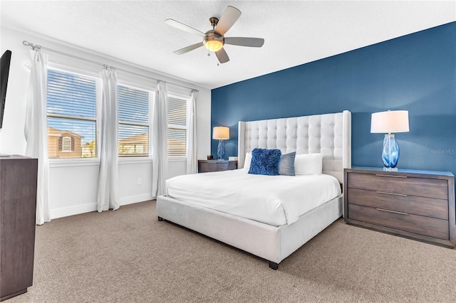 501 Burma St, Kissimmee, FL 34747 - bedroom with baseboards, carpet, ceiling fan, and a textured ceiling