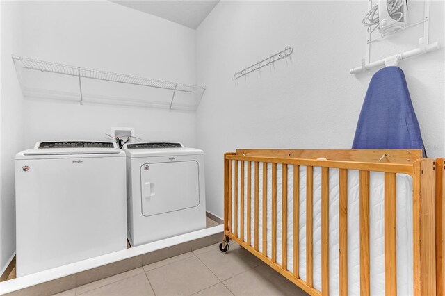 501 Burma St, Kissimmee, FL 34747 - laundry area featuring tile patterned floors, laundry area, and washer and dryer